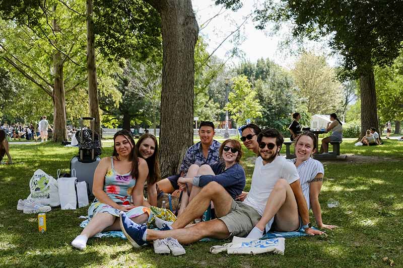 A group of people relaxing together in a park